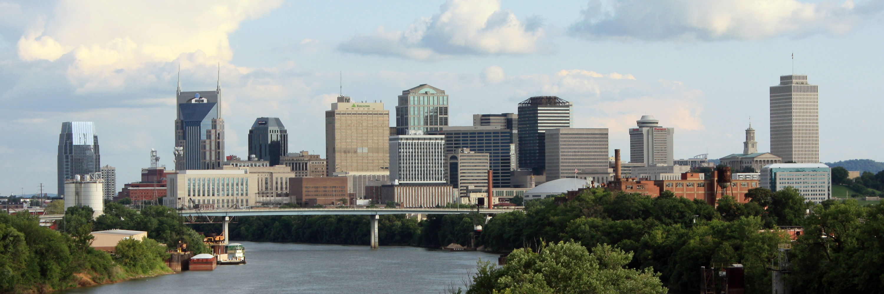 An archival panorama of Nashville’s skyline beside the Cumberland River.